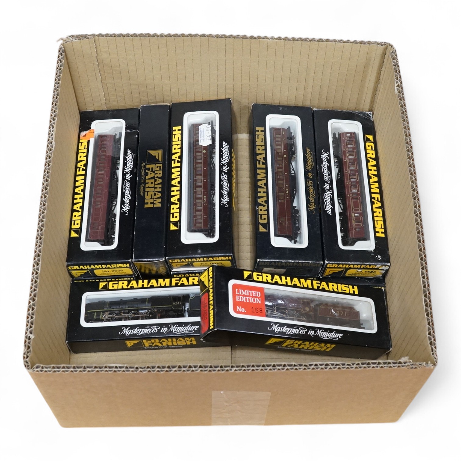 Eleven boxed Graham Farish N gauge LMS railway, including two locomotives; Coronation Class City of Glasgow 6242 (1811) and a 2-6-0 Crab 13071 (LE185A), together with nine LMS bogie coaches in Crimson Lake livery. Condit